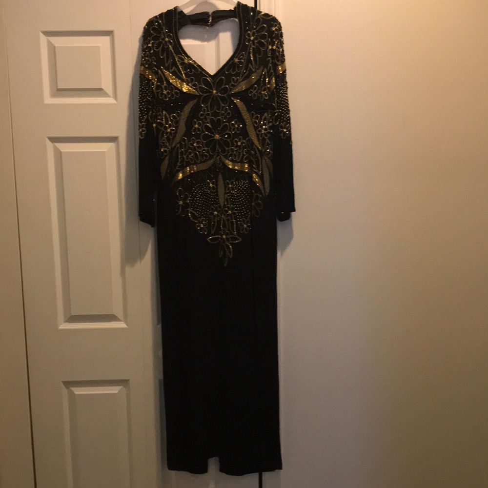 Black and Gold beaded evening gown. V neck front. Cut out back